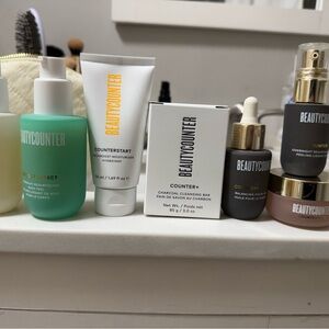 Beautycounter Skincare Collection with Green and White Bottles